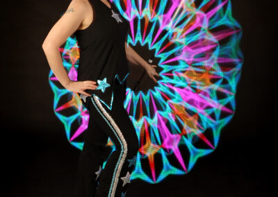 Kat Collett trad circus costume with LED staff