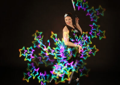 Kat Collett trad stars circus costume with LED poi